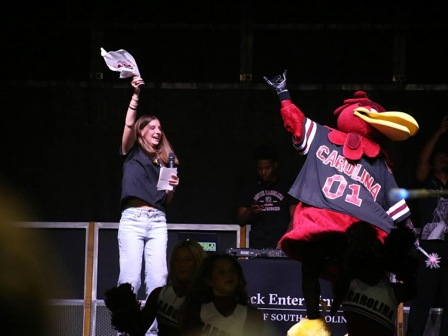 A Tiger Burn host and Cocky jump on stage during the playing of “SandStorm” during Tiger Burn at Blatt Field on Nov. 19, 2025. The annual event is part of the rivalry week of events leading up to a football game against Clemson.