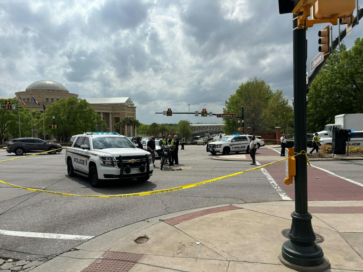 FILE — Columbia police surround the scene of an accident on the intersection of Assembly and Blossom streets on April 2, 2025. The student's motorcycle remains on the street.