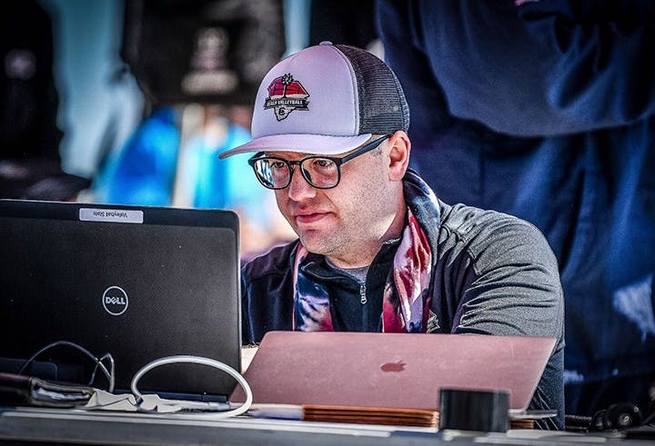 Photo of Joe Kepler, the sports information director for the indoor volleyball team and beach volleyball team.