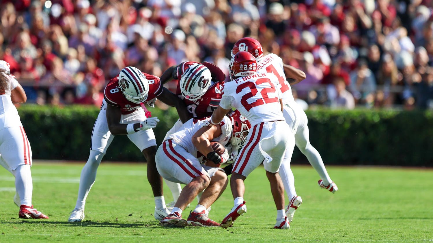 FILE — An Oklahoma defender carries the football after catching an interception from freshman quarterback Cutter Woods on Oct. 18, 2025, at Williams-Brice Stadium. The Gamecocks have thrown nine interceptions on the season.