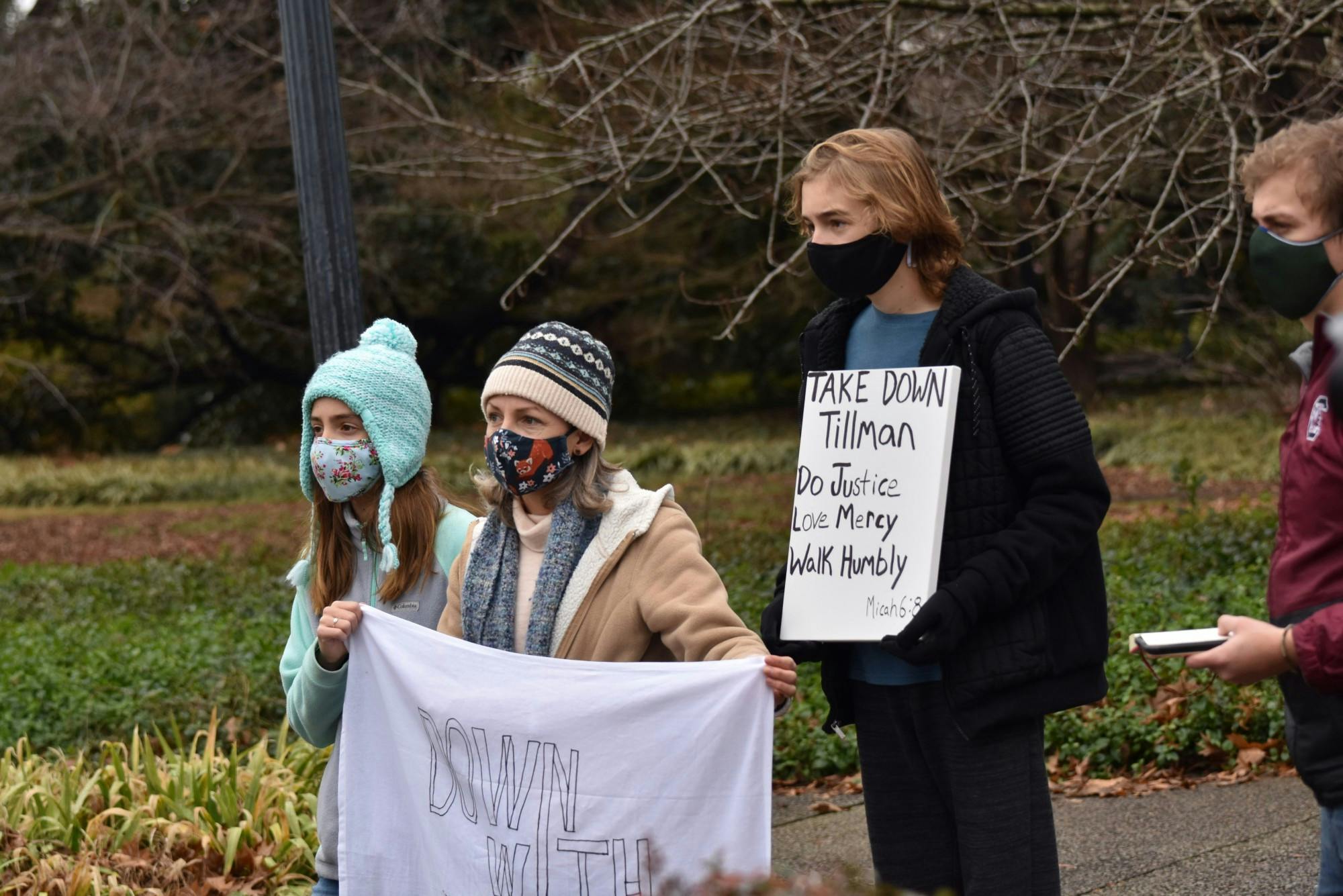 Protestors stand in front of the Benjamin Tillman statue located at the South Carolina Statehouse. The protestors called for the removal of the statue based on Benjamin Tillman's history.
