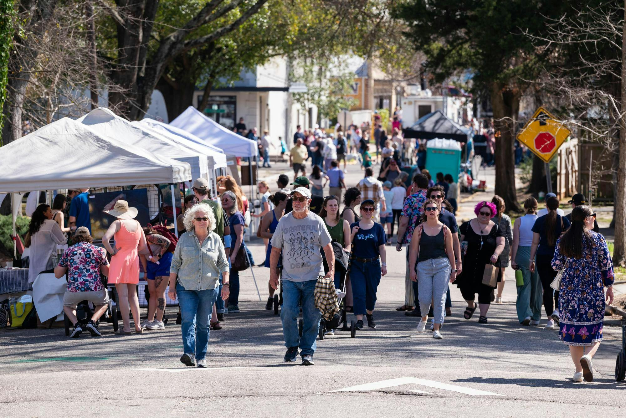Attendees stroll among artists in the streets of Cottontown, Columbia, during the 2025 Cottontown Art Crawl.