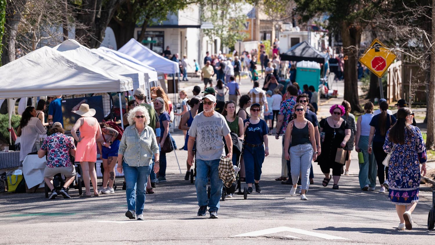 Attendees stroll among artists in the streets of Cottontown, Columbia, during the 2025 Cottontown Art Crawl.