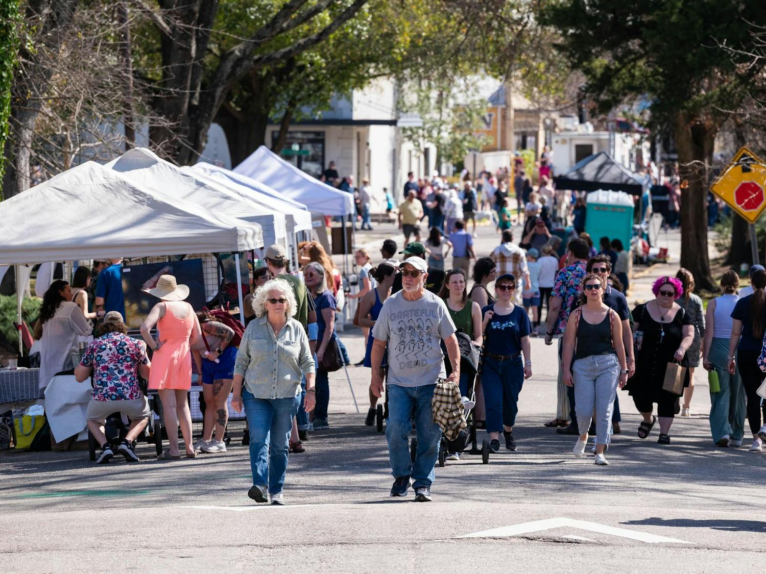 Attendees stroll among artists in the streets of Cottontown, Columbia, during the 2025 Cottontown Art Crawl.