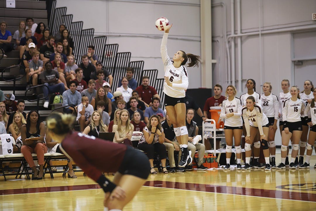 Senior setter Courtney Koehler serves against University of North Carolina at Charlotte on Sept. 10.