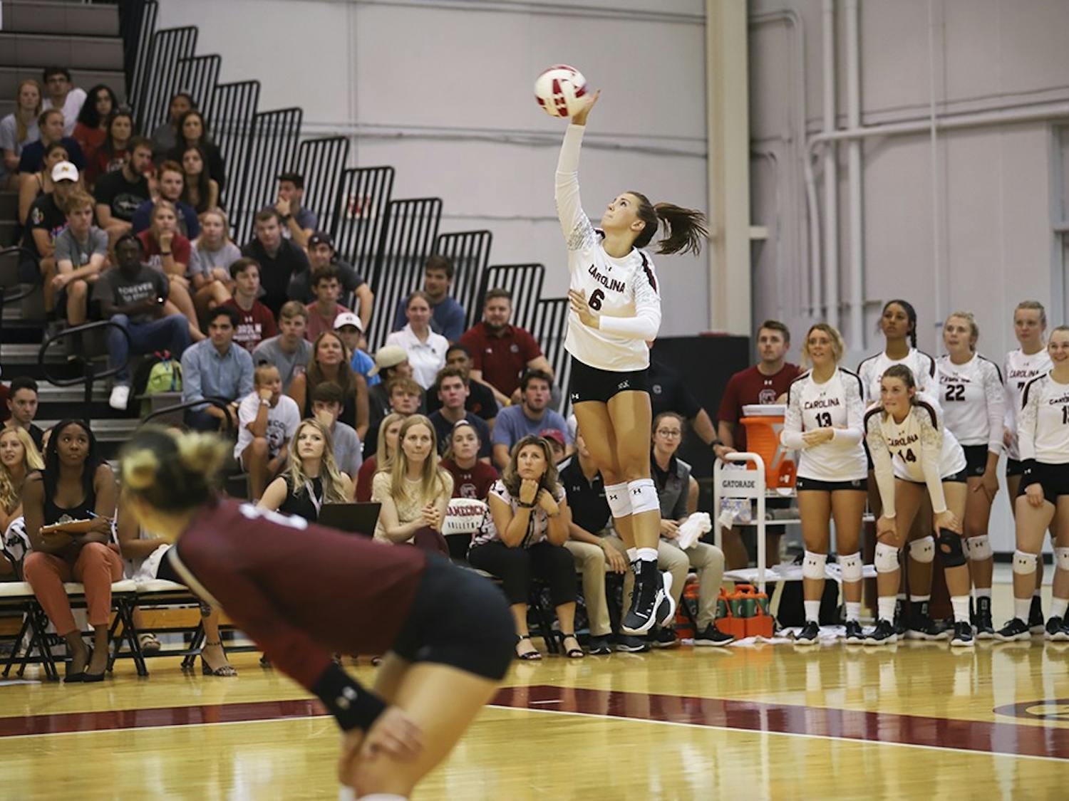 Senior setter Courtney Koehler serves against University of North Carolina at Charlotte on Sept. 10.