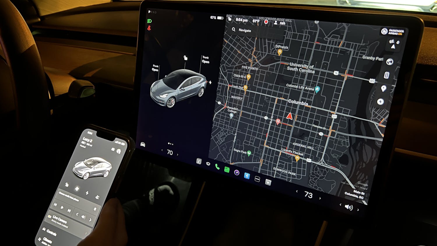 Columbia resident Laura Streit uses the Tesla app in her Tesla Model 3 to find a nearby charging station on Feb. 8, 2023. A Tesla's built-in touch screen offers an easy-to-use navigation system to help drivers locate supercharger stations and other necessities.&nbsp;