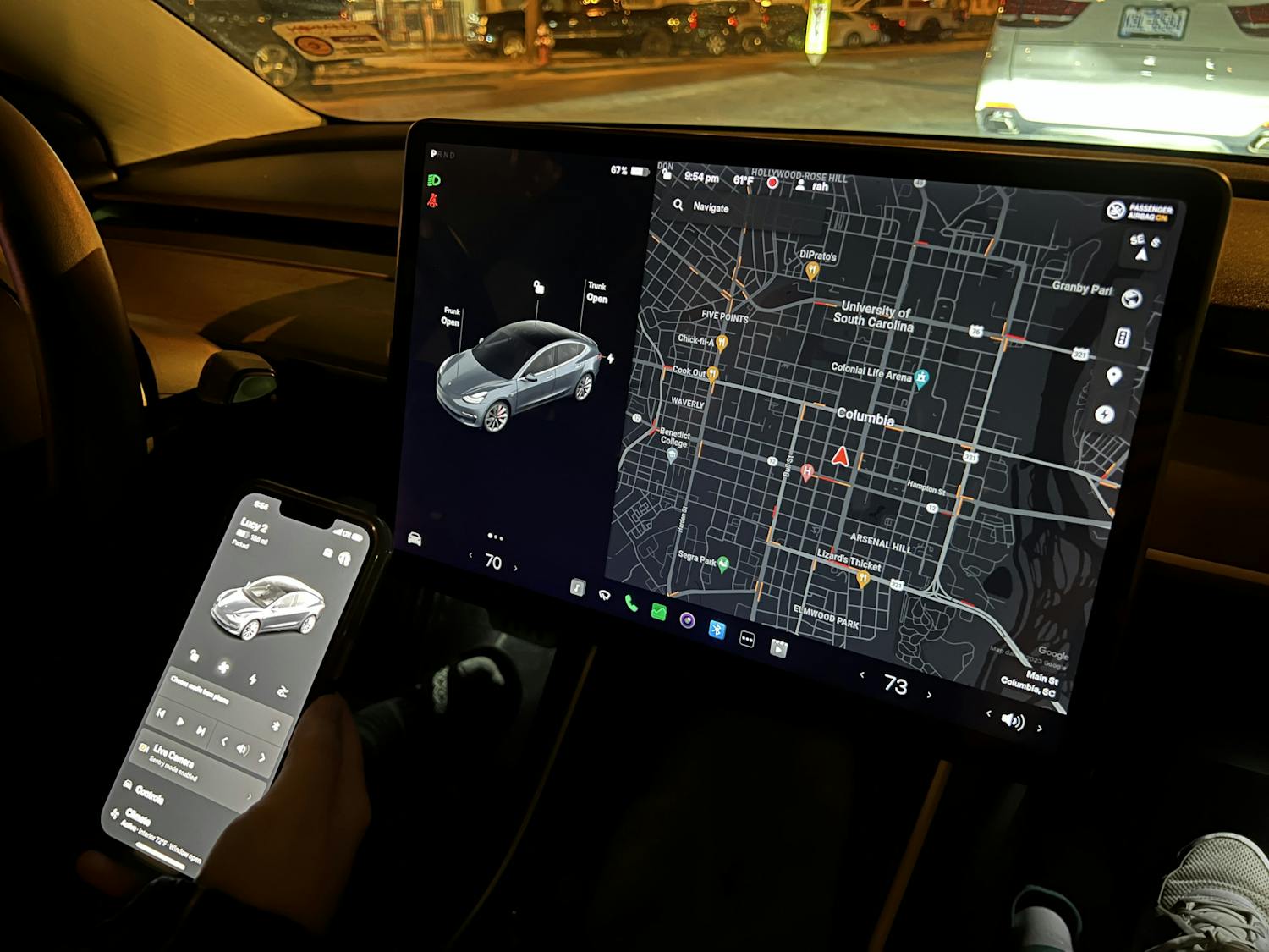 Columbia resident Laura Streit uses the Tesla app in her Tesla Model 3 to find a nearby charging station on Feb. 8, 2023. A Tesla's built-in touch screen offers an easy-to-use navigation system to help drivers locate supercharger stations and other necessities.&nbsp;