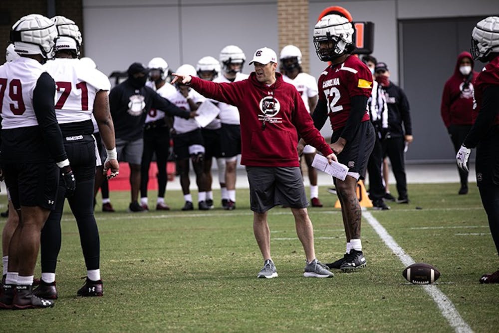 Head football coach Shane Beamer works with members of the offensive and defensive lines at the Gamecocks' first spring practice on Saturday, March 20.
