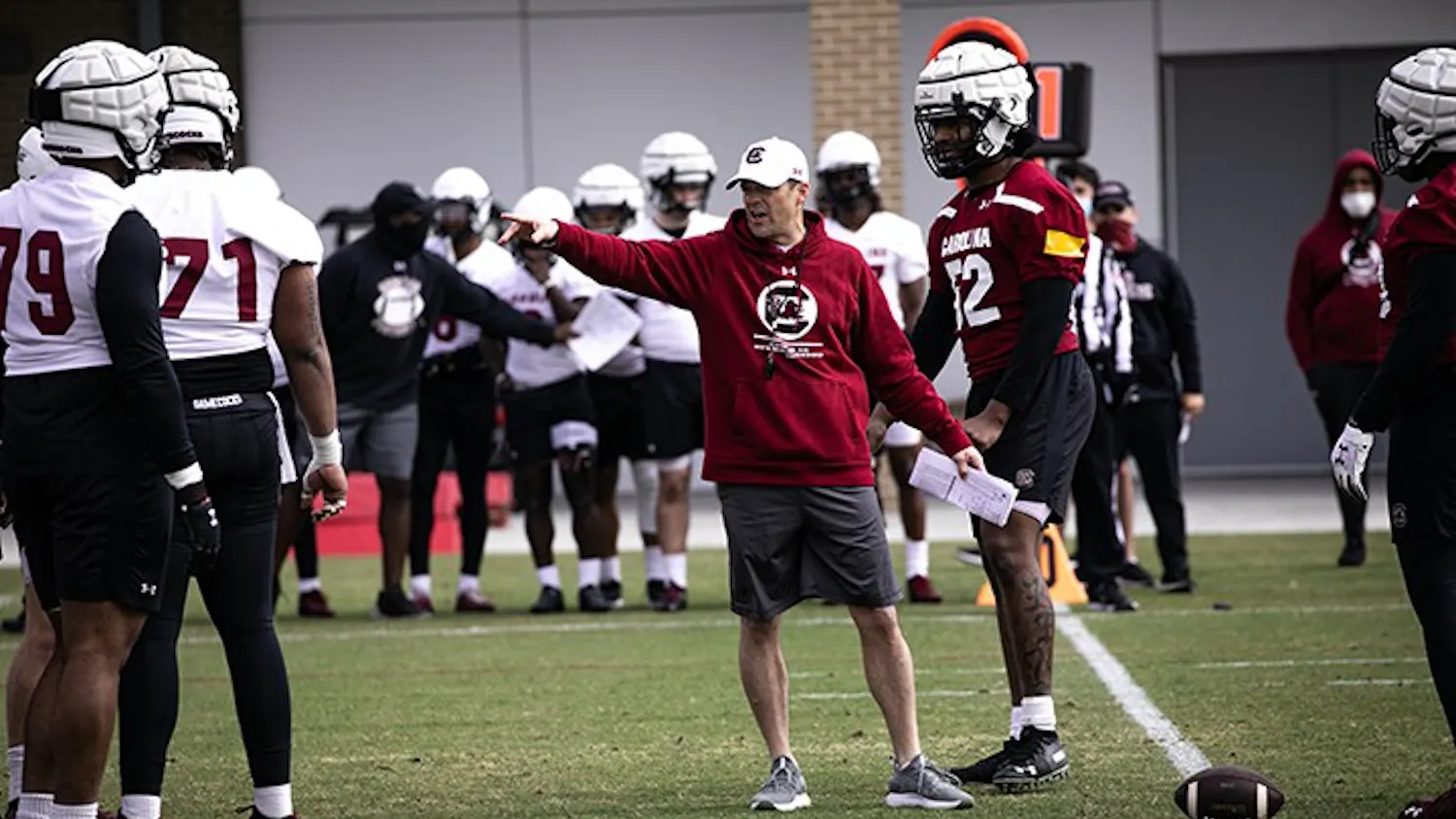 Head football coach Shane Beamer works with members of the offensive and defensive lines at the Gamecocks' first spring practice on Saturday, March 20.