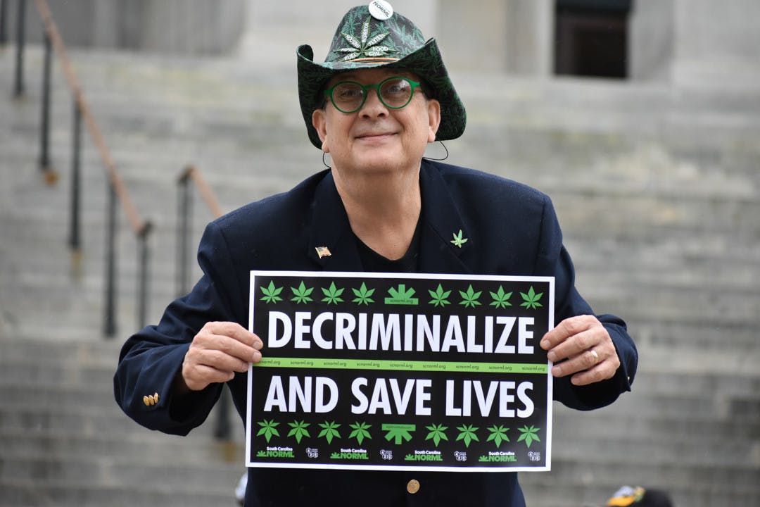 Scott Weldon holds a sign advocating for medical cannabis use. Weldon is the executive director for SC NORML.