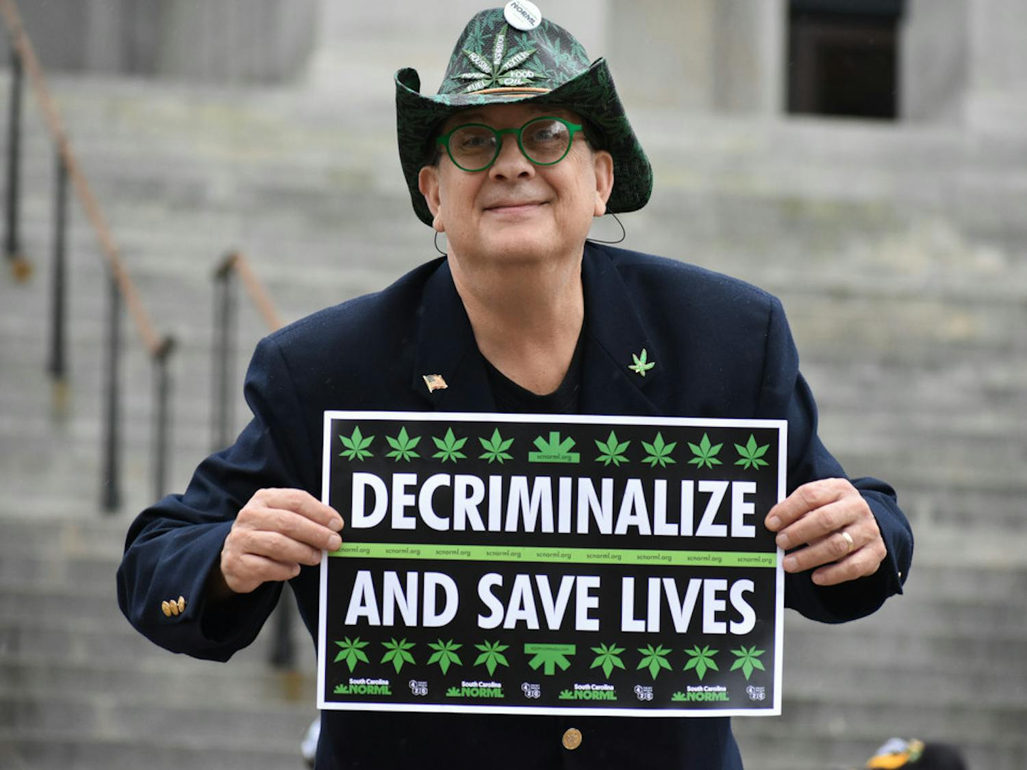 Scott Weldon holds a sign advocating for medical cannabis use. Weldon is the executive director for SC NORML.