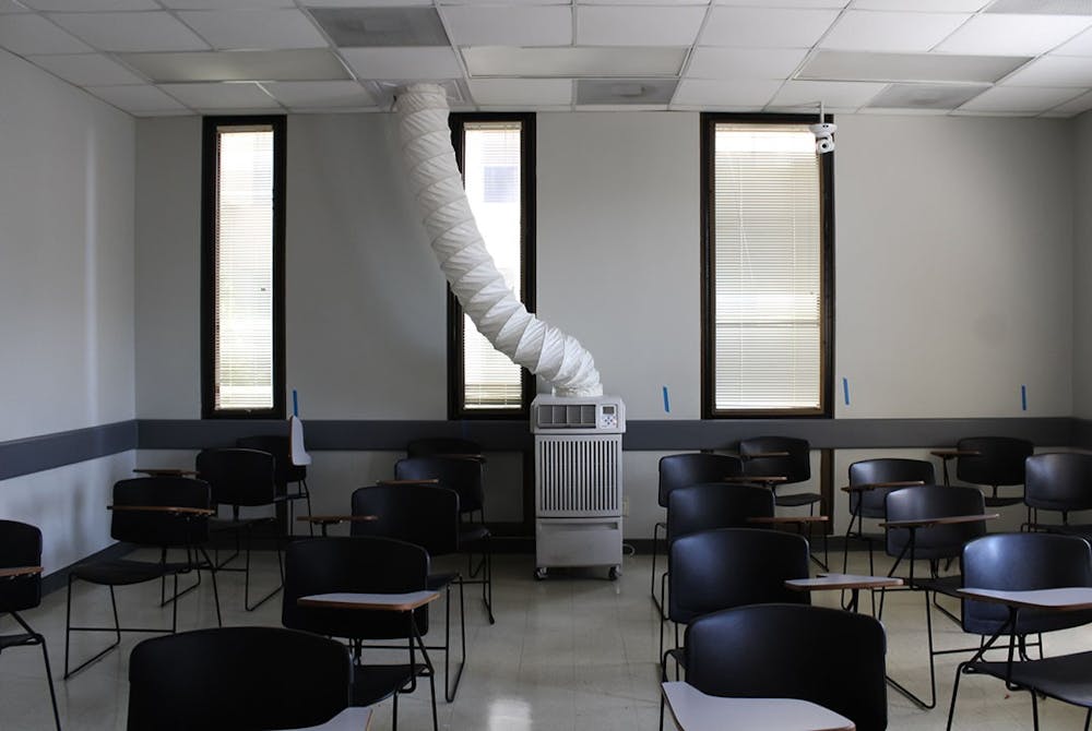 <p>A picture of a portable HVAC unit in the Humanities Classroom Building. The failing air conditioning system will be replaced but is a current threat to the electrical systems, has caused discomfort for students, faculty and staff and could promote the spread of COVID-19.</p>