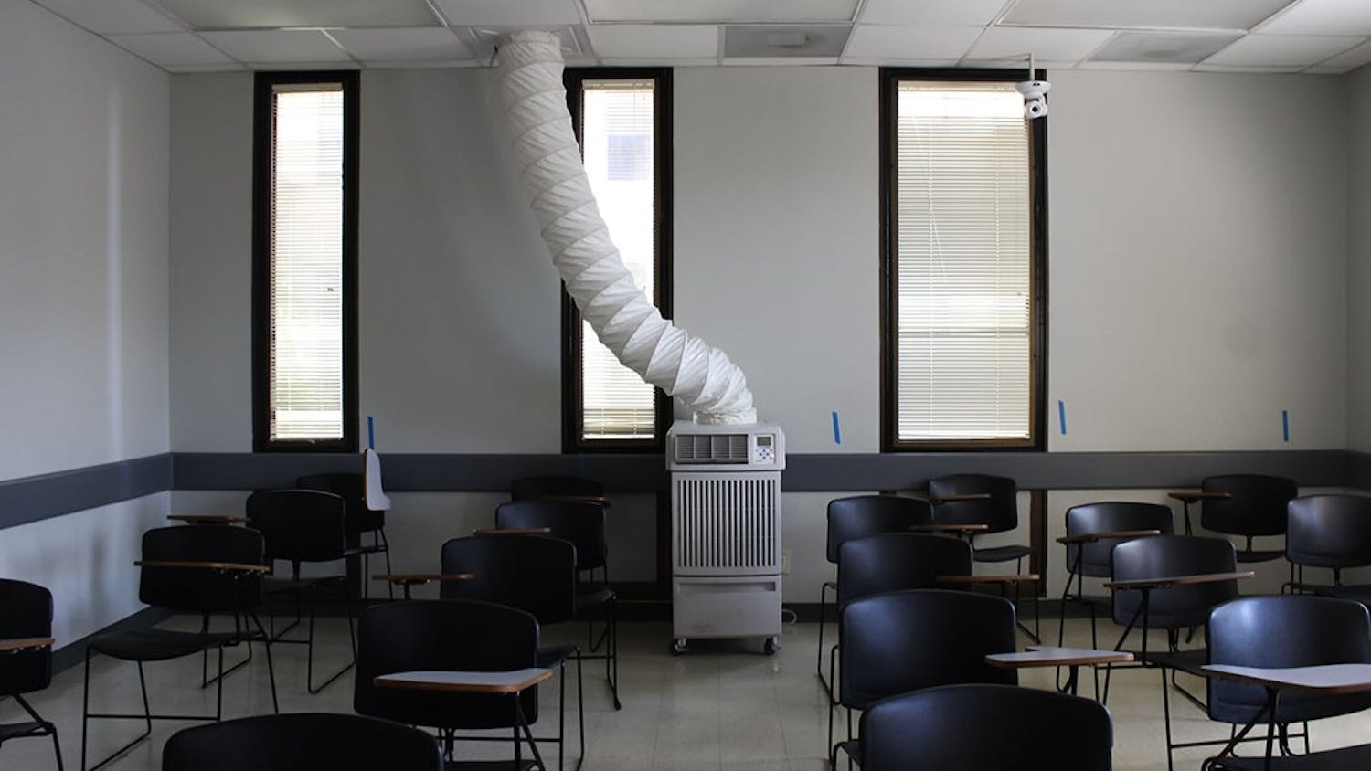 A picture of a portable HVAC unit in the Humanities Classroom Building. The failing air conditioning system will be replaced but is a current threat to the electrical systems, has caused discomfort for students, faculty and staff and could promote the spread of COVID-19.