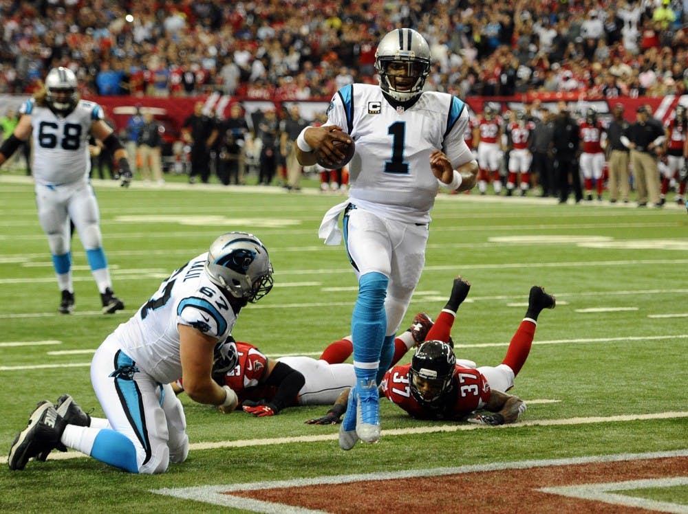 Carolina Panthers&apos; Cam Newton (1) runs into the end zone for a touchdown past Atlanta Falcons&apos; Ricardo Allen (37) during the first quarter on Sunday, Dec. 27, 2015, at Georgia Dome in Atlanta. (David T. Foster III/Charlotte Observer/TNS)