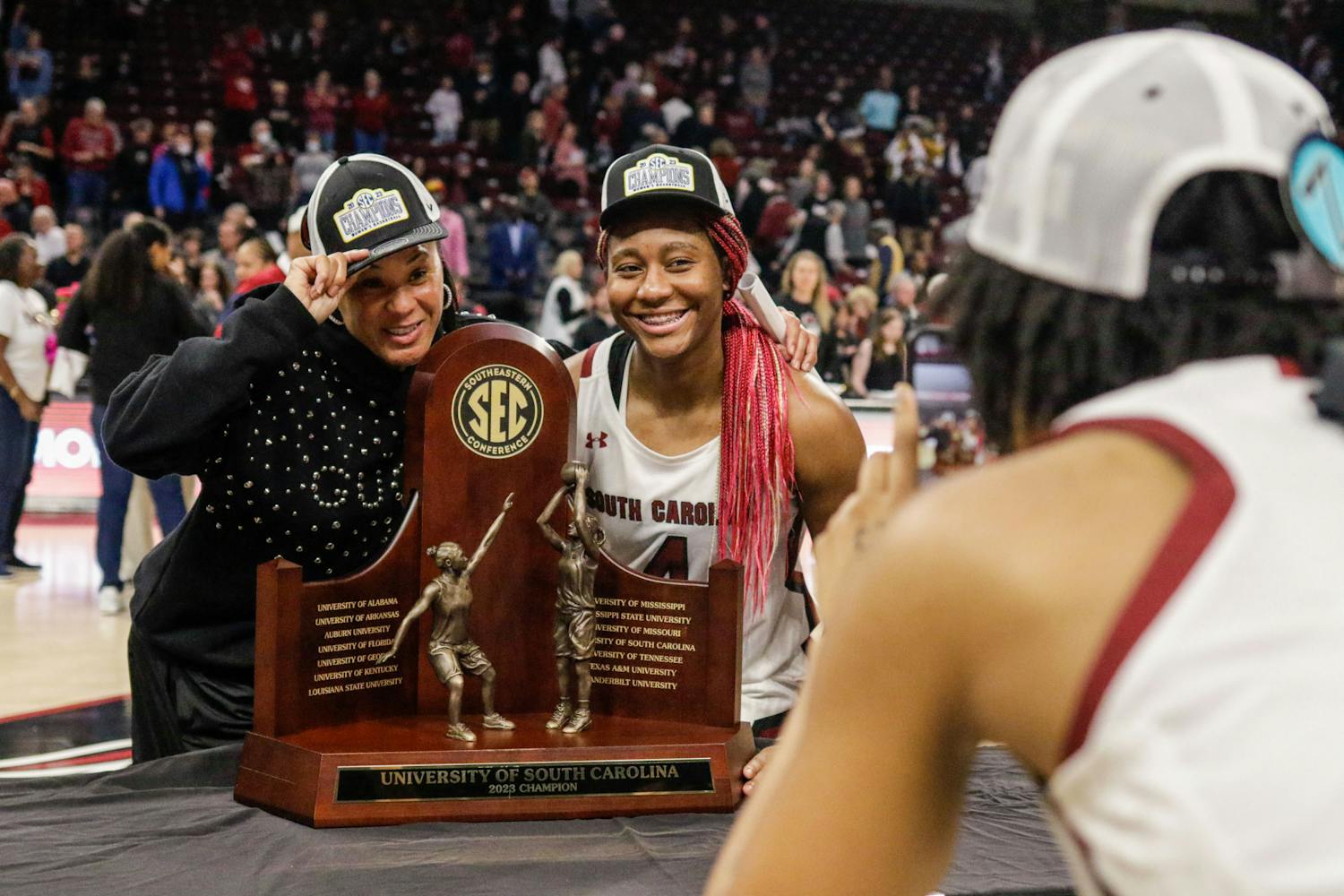 Head coach Dawn Staley and senior forward Aliyah Boston pose with the SEC regular 鶹С򽴫ý championship trophy after South Carolina’s game against Georgia at Colonial Life Arena on Feb. 26, 2023. The Gamecocks beat the Bulldogs 73-63.