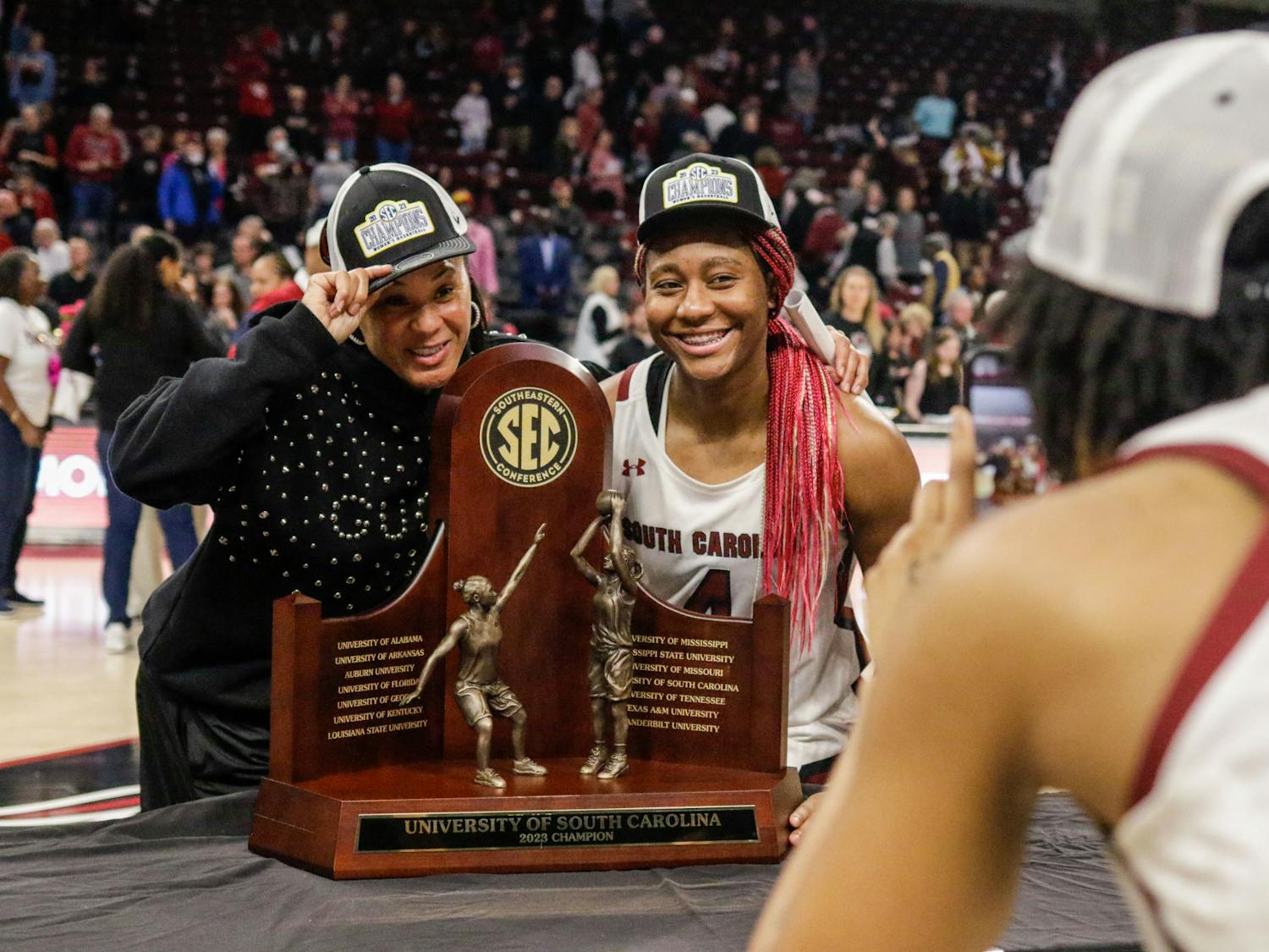 Head coach Dawn Staley and senior forward Aliyah Boston pose with the SEC regular season championship trophy after South Carolina’s game against Georgia at Colonial Life Arena on Feb. 26, 2023. The Gamecocks beat the Bulldogs 73-63.