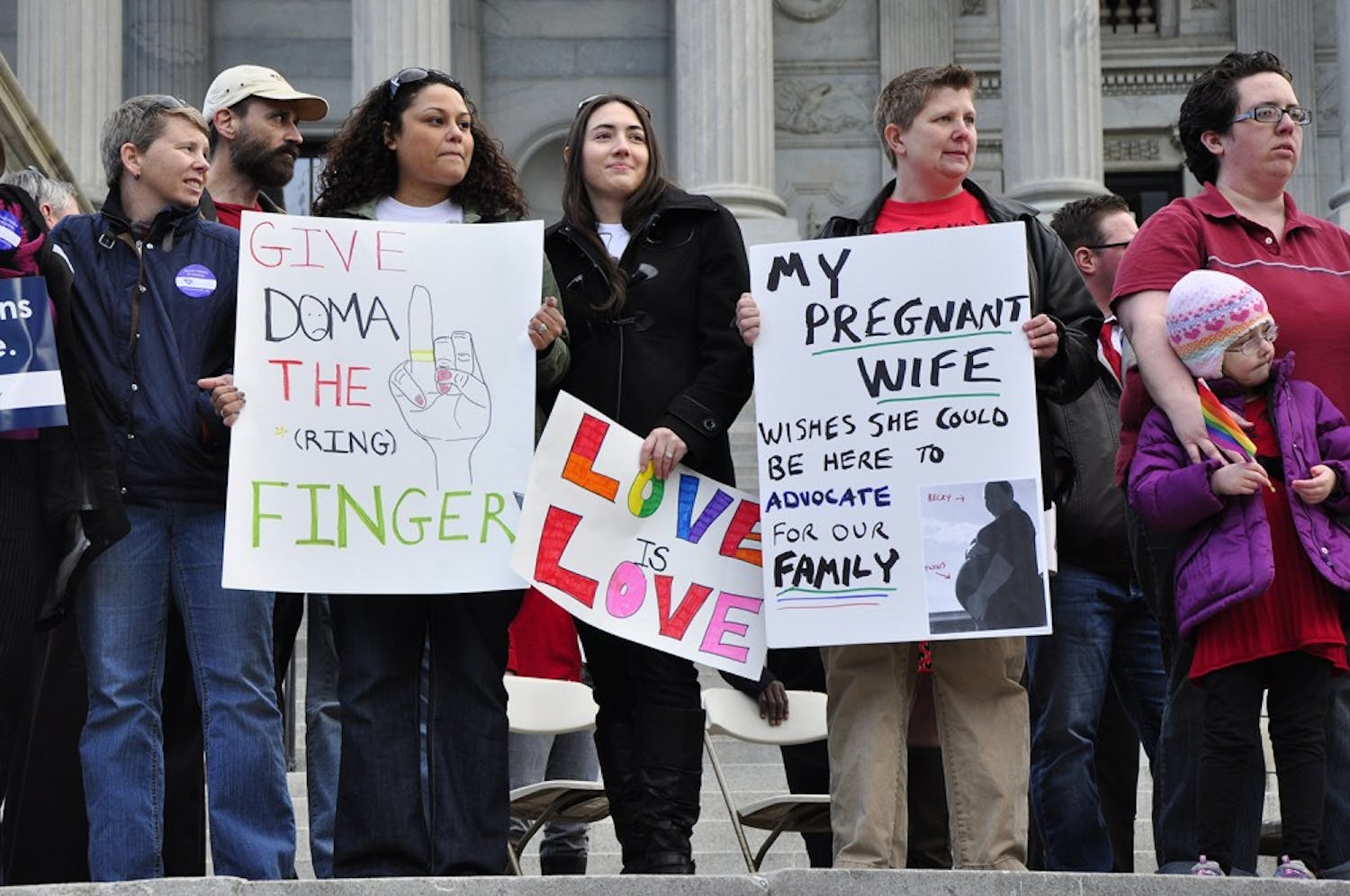 Those who had been affected by the Defense of Marriage Act were asked to come forward and stand on the Statehouse steps at Tuesday's rally.