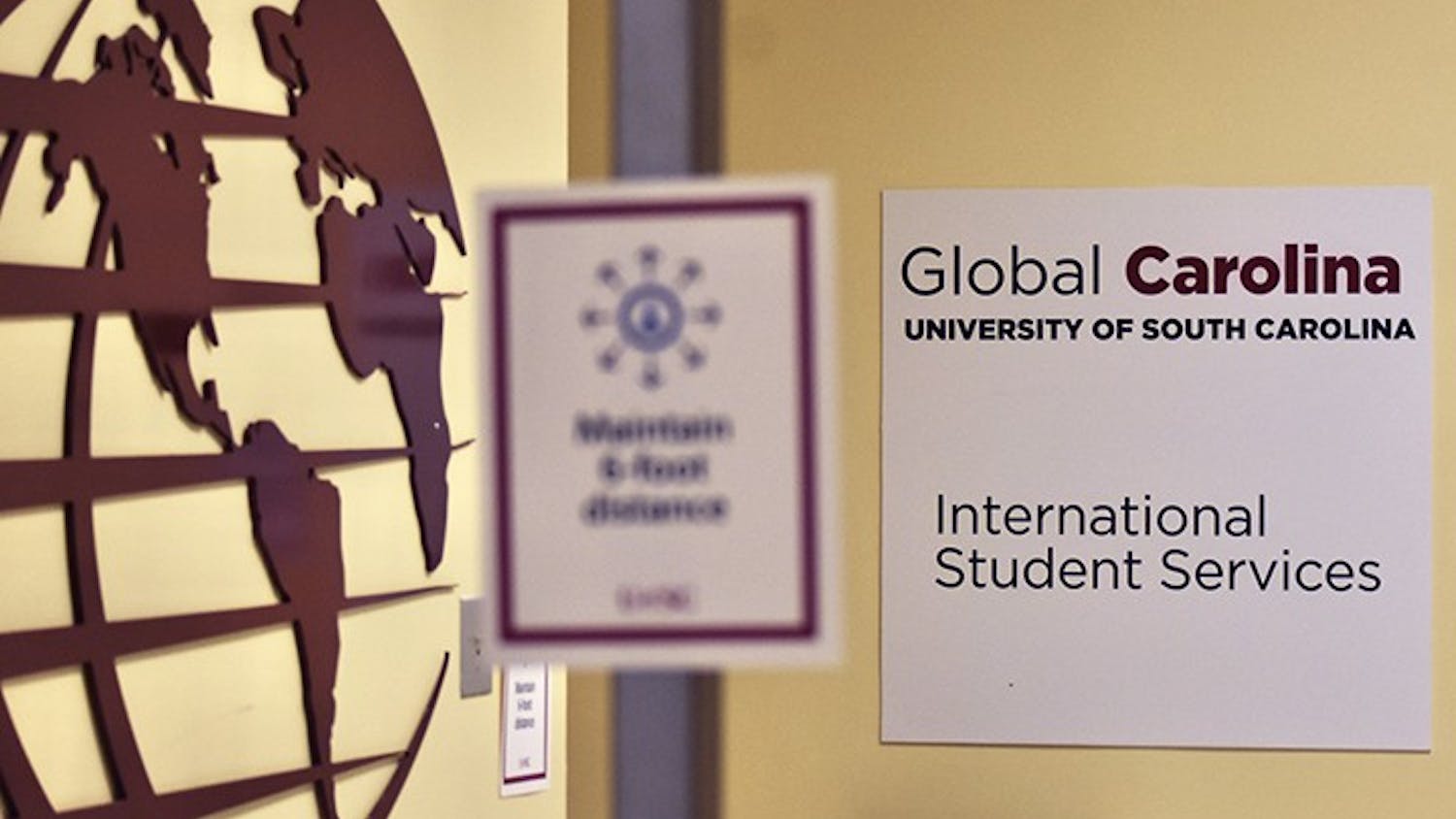 A sign marks the entrance to the International Student Services office in the Close-Hipp building. International student enrollment at USC has seen about a 20% drop this semester.