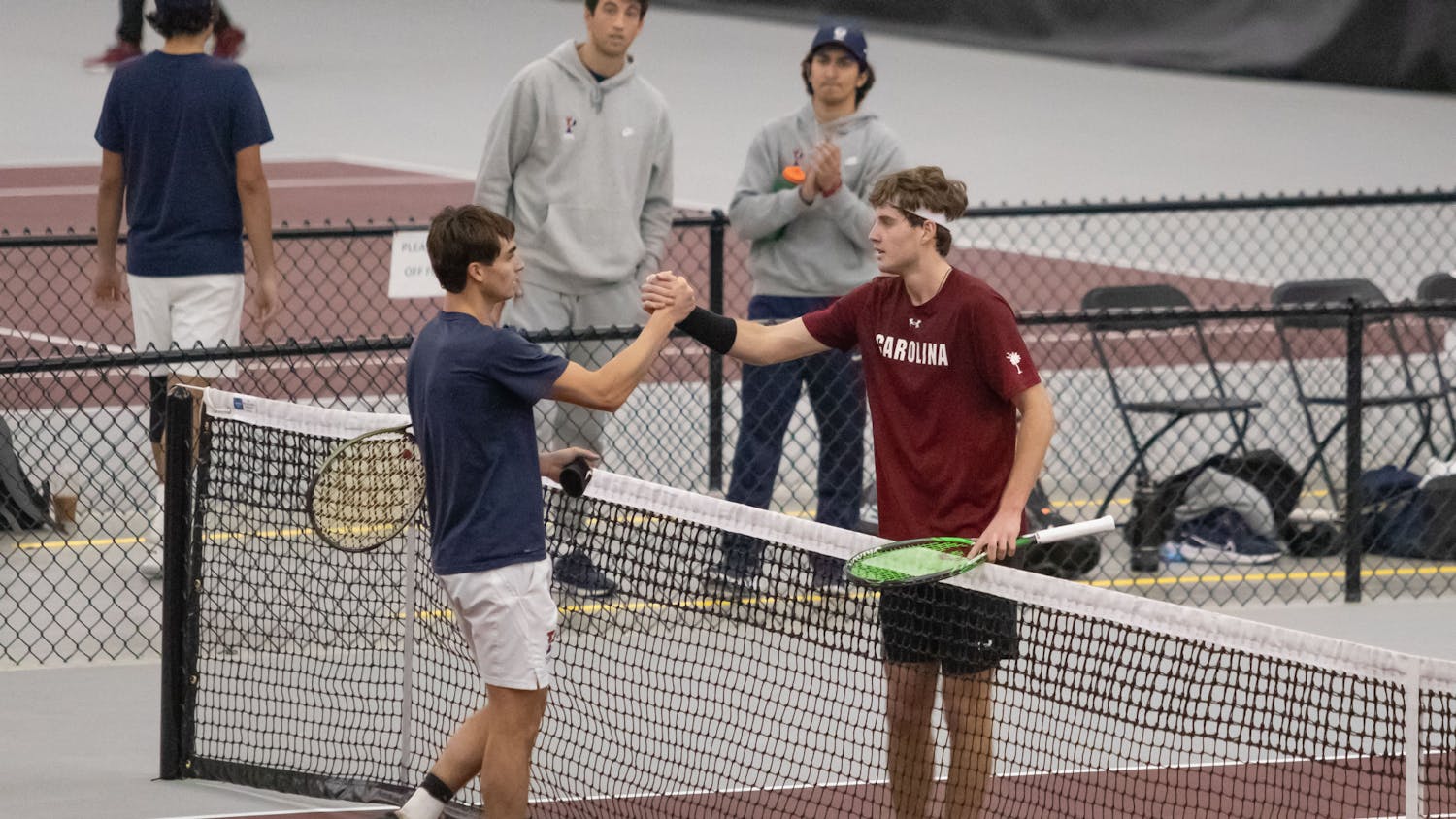 Junior Toby Samuel shakes hands after winning his singles match against Penn at the ITA Kickoff Weekend event at the Carolina Indoor Tennis Center on Jan. 28, 2023. South Carolina beat Penn 4-0.