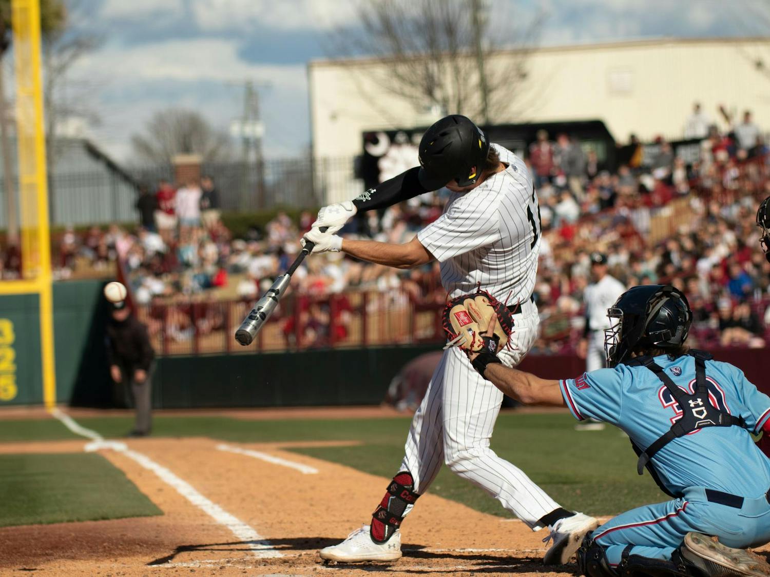 Senior infielder Tyler Causey makes contact with the ball during South Carolina's game against Belmont on Feb. 24, 2024, at Founders Park. Causey went 1-5 in the Gamecocks' 11-2 loss to the Bruins.