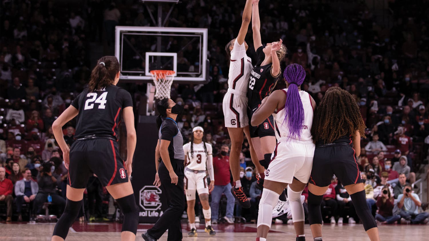 Senior forward Victaria Saxton works to gain possession of the ball during the tip-off on Dec. 21, 2021. The South Carolina women's basketball team defeated No. 2 Stanford 65-61.