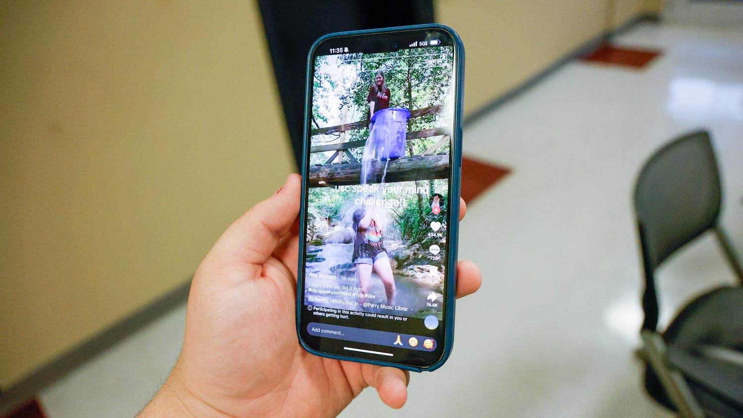 A phone playing a TikTok featuring a group of girls doing the "SpeakYourMind" ice bucket challenge. The challenge attempts to spread mental health awareness across social media platforms like TikTok and Instagram