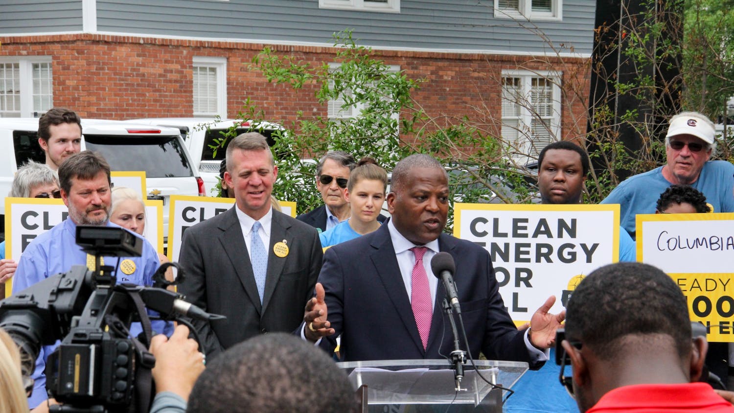 Former Mayor Stephen K. Benjamin speaks to the press after signing a resolution to move the city of Columbia to 100% renewable energy.