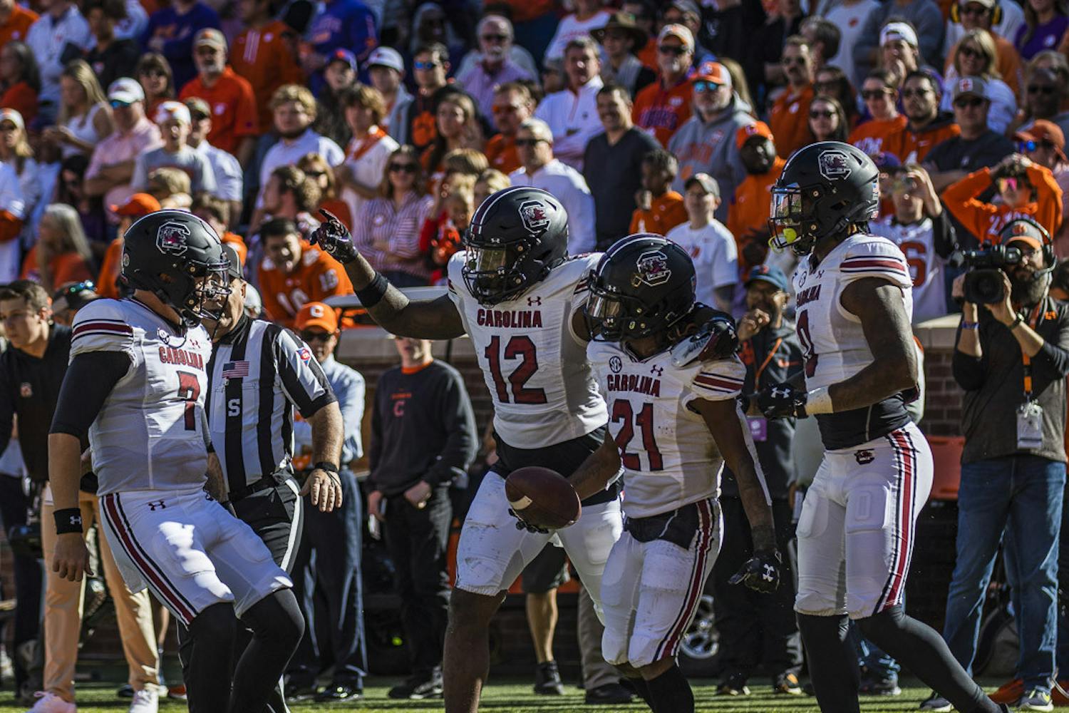 Redshirt junior quarterback Spencer Rattler (left) celebrates with (from left to right) redshirt junior tight end Traevon Kenion, junior running back Juju McDowell and junior tight end Jaheim Bell after he completes a pass to McDowell during the matchup between South Carolina and Clemson at Memorial Stadium in Clemson, South Carolina, on Nov. 26, 2022. The Gamecocks upset the Tigers 31-30, marking the first time South Carolina has beaten Clemson since 2013.
