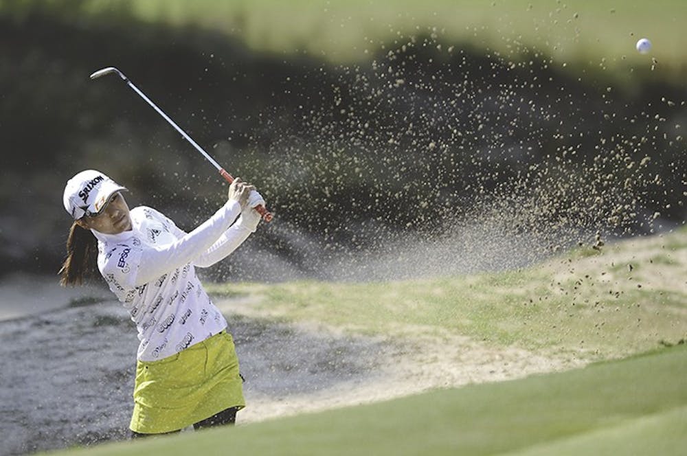 Sakura Yokomine hits out of a sand bunker on the 16th hole during the first day of the 2014 U.S. Women&apos;s Open at Pinehurst No. 2 in Pinehurst, N.C., Thursday, June 19, 2014. (Ethan Hyman/Raleigh News &amp; Observer/MCT)