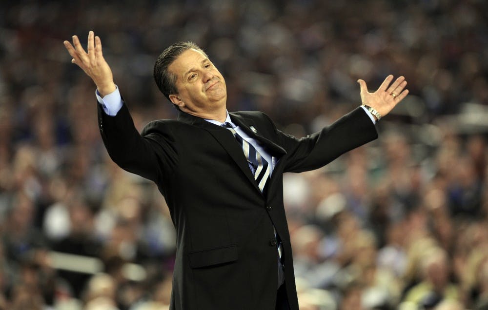 Kentucky coach John Calipari doesn't know what to do about UConn as the Connecticut Huskies beat the Kentucky Wildcats 60-54 in the NCAA Final Four championship game at AT&T Stadium in Arlington, Texas, Monday, April 7, 2014. (Stephen Dunn/Hartford Courant/MCT)