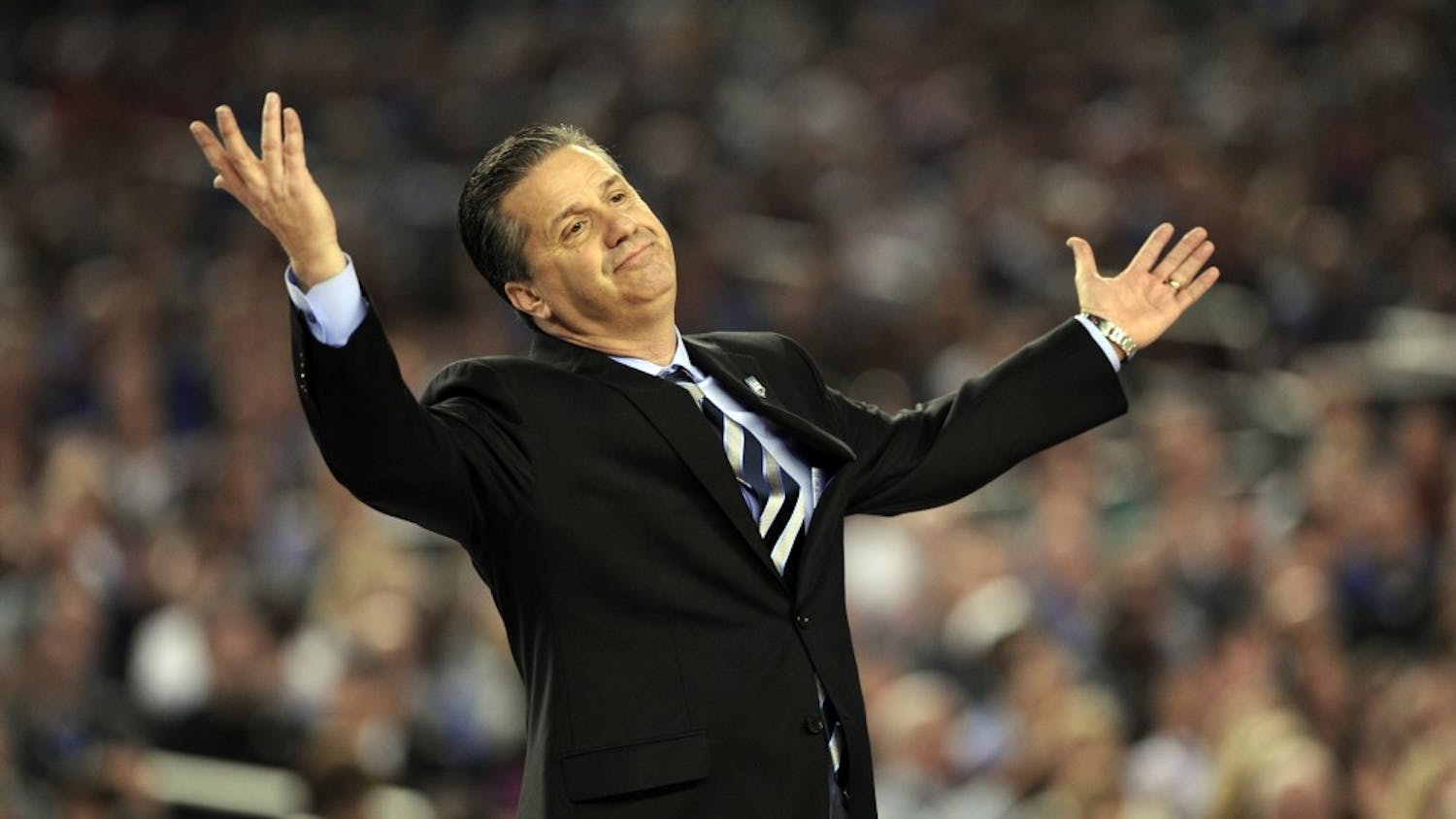 Kentucky coach John Calipari doesn't know what to do about UConn as the Connecticut Huskies beat the Kentucky Wildcats 60-54 in the NCAA Final Four championship game at AT&T Stadium in Arlington, Texas, Monday, April 7, 2014. (Stephen Dunn/Hartford Courant/MCT)