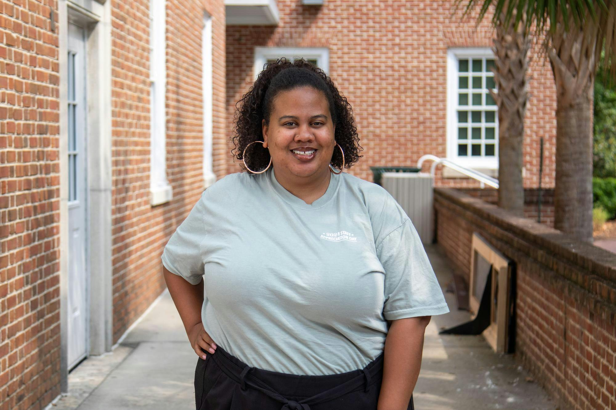 Kelli Carroll, the USC College of Information and Communications Career Services Manager, poses outside the USC School of Journalism and Mass Communications on June 17, 2024. Carroll has served as the college's career services manager for nearly two years, assisting students with resumes, interviews, and other career advice.
