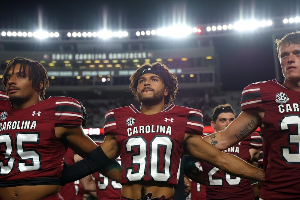 <p>FILE — From left to right, redshirt sophomore running back Chase McCracken, redshirt sophomore defensive back Jace Blackshear, and fifth-year punter Kai Kroeger line up for the playing of the alma mater after South Carolina’s game against Old Dominion on Aug. 31, 2024. The Gamecocks defeated the Monarchs 23-19 in the teams’ first-ever matchup.</p>