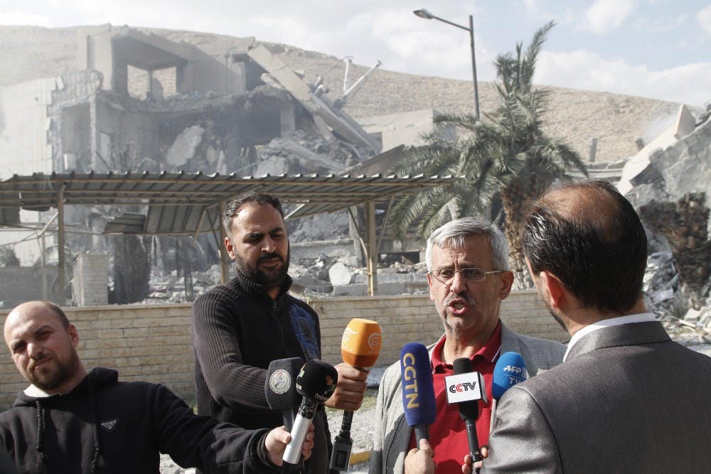 Saeed Saeed, head of the Institute for the Development of Pharmaceutical and Chemical Industries, speaks to reporters in front of the research center, which was hit by the U.S.-led missile attacks in the Barzeh neighborhood, on Saturday, April 14, 2018. Saeed denied the facility was in possession of chemical weapons. (Monsef Memary/Xinhua/Zuma Press/TNS)