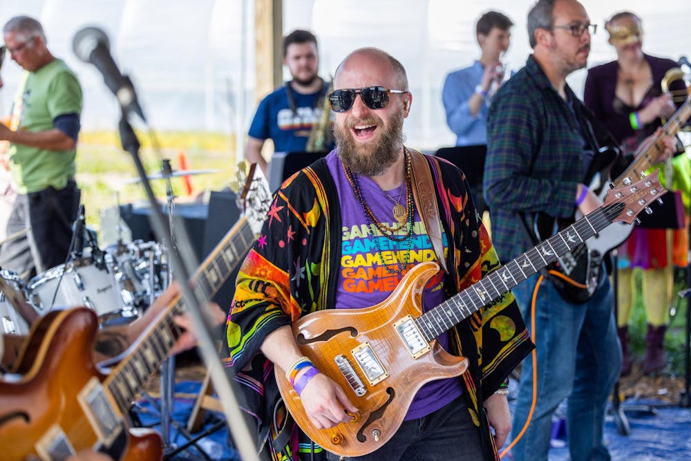 <p>A bearded man sings at Mardi Gras in Columbia, South Carolina in 2022. The event is an annual festival celebrating the spirit of Mardi Gras and the lively community of Columbia.</p>