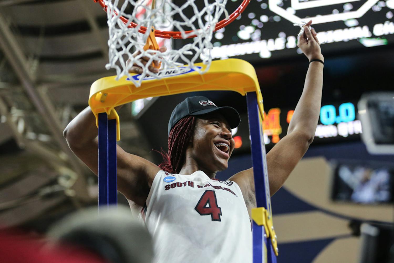 Senior forward Aliyah Boston cuts a piece off of the basket from the Elite Eight game on March 27, 2023, at the Bon Secours Wellness Arena in Greenville, S.C. The Gamecocks defeated Maryland 86-75.