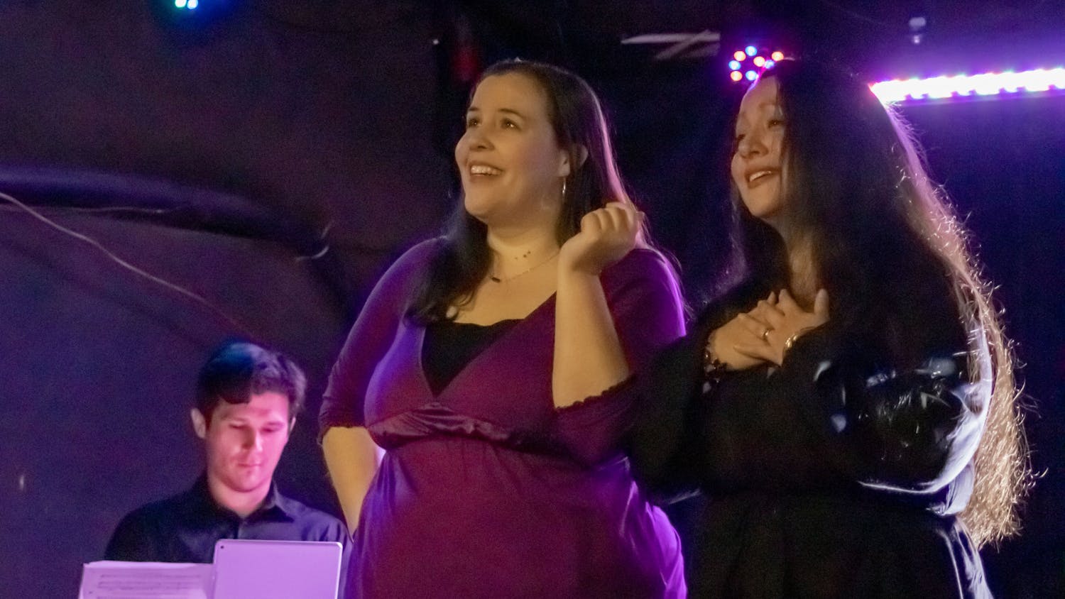 Maria Beery (left) and Jennifer Mitchell (right) sing about their respective love lives during the performance of "Four Singers Walk Into A Bar" on March 26, 2023. They performed at New Brookland Tavern and various local bars in the Columbia area.