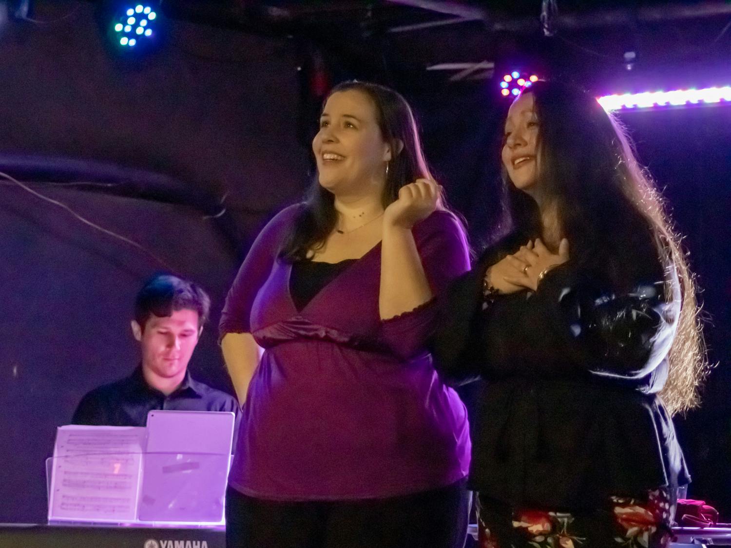 Maria Beery (left) and Jennifer Mitchell (right) sing about their respective love lives during the performance of "Four Singers Walk Into A Bar" on March 26, 2023. They performed at New Brookland Tavern and various local bars in the Columbia area.