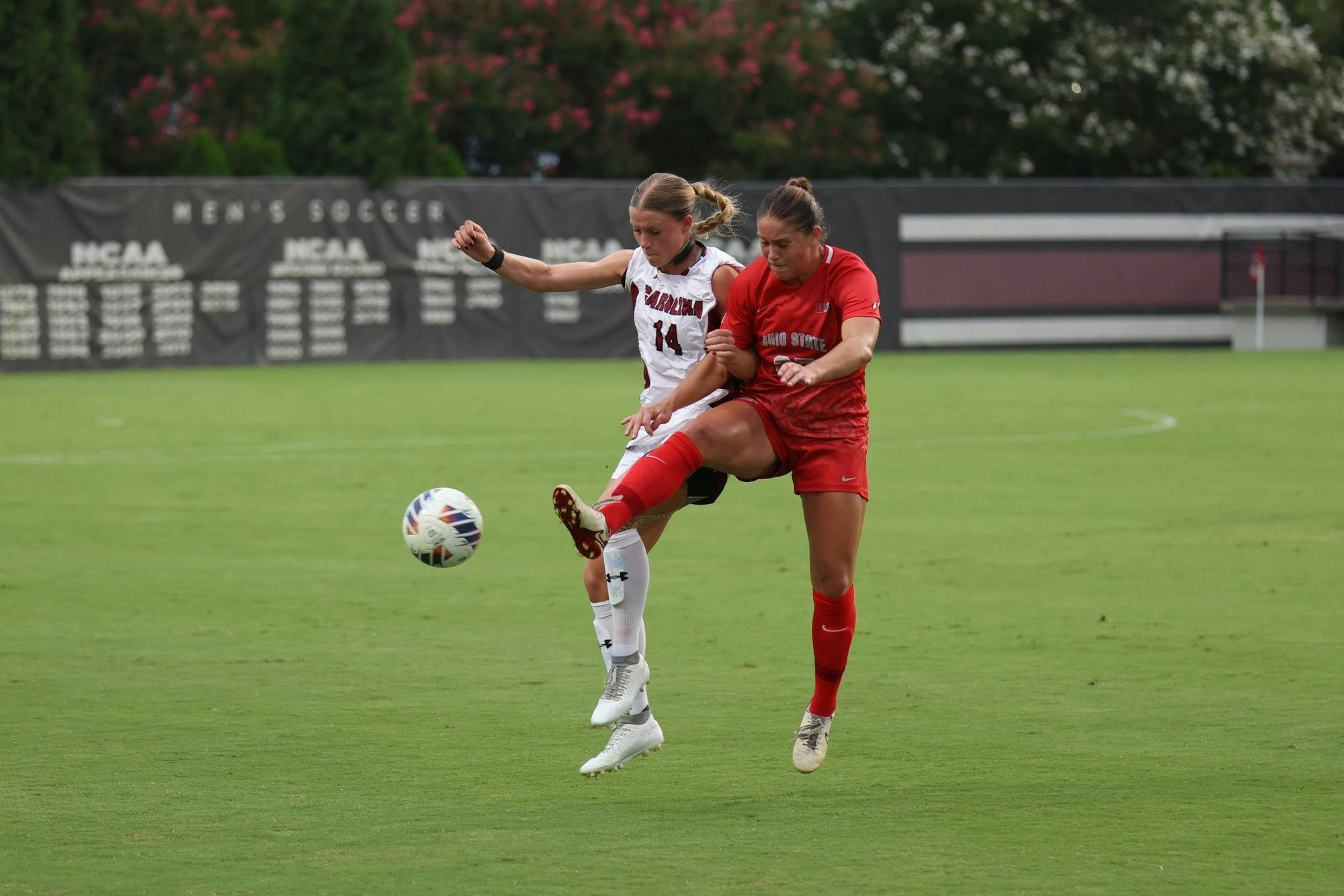 Senior defender Taylor Bloom attempts to kick the ball against an opposing player during the game against Ohio State at Eugene E. Stone III Stadium on Aug. 21, 2025. Bloom scored her second goal of the season at the game against Oklahoma on Sept. 26, 2025.