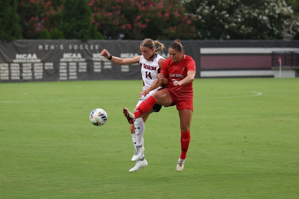 <p>Senior defender Taylor Bloom attempts to kick the ball against an opposing player during the game against Ohio State at Eugene E. Stone III Stadium on Aug. 21, 2025. Bloom scored her second goal of the season at the game against Oklahoma on Sept. 26, 2025.</p>