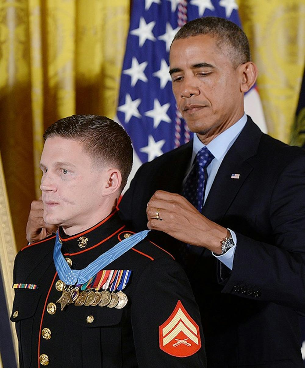 U.S. Marine Corps Cpl. William &quot;Kyle&quot; Carpenter is awardedthe Medal of Honor by President Barack Obama on Thursday, June 19, 2014, at the White House in Washington, D.C. (Olivier Douliery/Abaca Press/MCT)