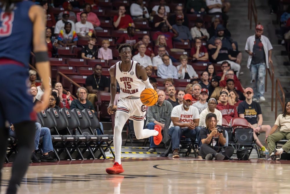 <p>FILE - Sophomore guard Morris Ugusuk dribbles the ball down the court in the game against South Carolina State on Nov. 8, 2024, at Colonial Life Arena. The Gamecocks defeated the Bulldogs by a score of 86-64.</p>