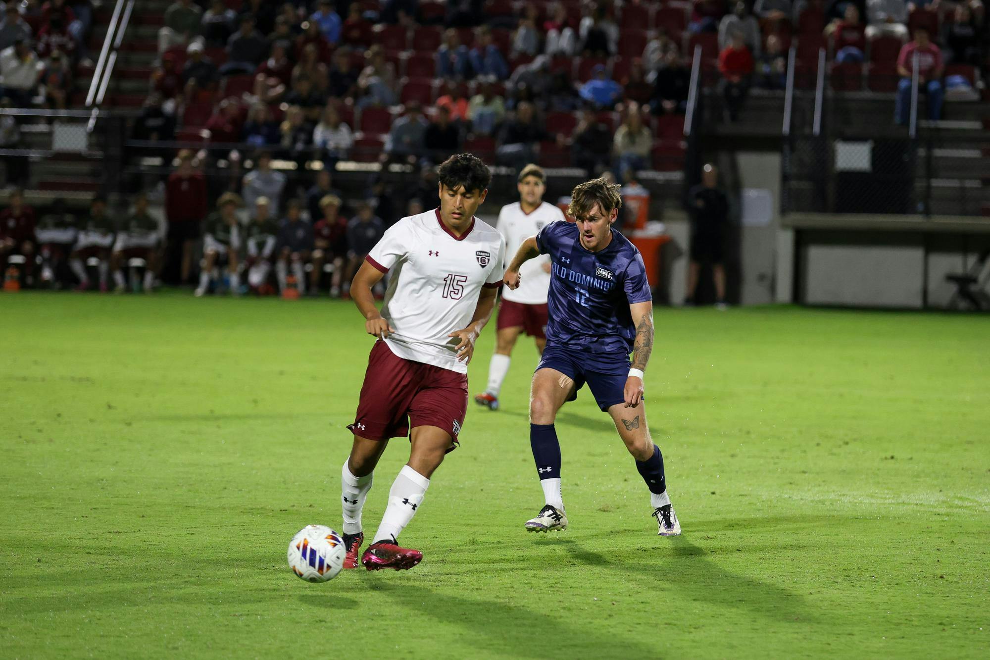 Sophomore midfielder Alejandro Velazquez-Lopez passes the ball while guarding against an opposing player during the game against Old Dominion University on Oct. 10, 2025, at Stone Stadium. Velazquez-Lopez made one shot on the goal out of his two shots overall.