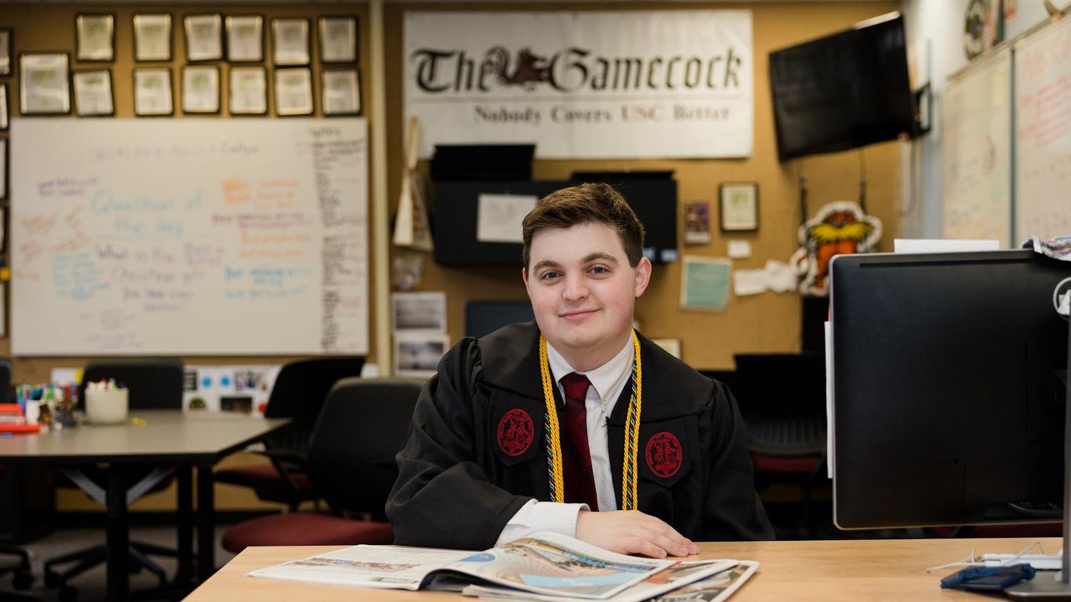 An environmental portrait of Will Kronsberg, a fourth-year broadcast journalism student, sitting at his desk in The Daily Gamecock office on Dec. 4, 2023. Kronsberg spent seven semesters working for Garnet Media Group, rising to the ranks of managing editor for The Daily Gamecock and assistant station manager for SGTV.