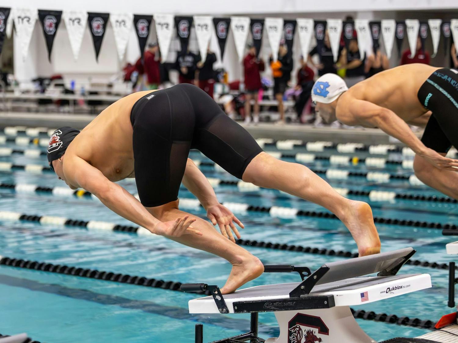 Sophomore freestyle swimmer Anthony Whittall dives into the water to start the men’s 200-yard freestyle event against North Carolina on Nov. 7, 2025, at the Carolina Natatorium. Whittall finished in eighth place with a time of one minute, 40.38 seconds.