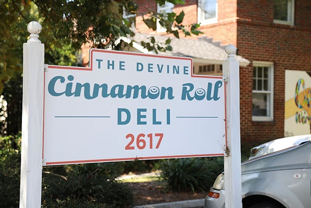 <p>&nbsp;The Cinnamon Roll Deli sign is visible to drivers passing on Divine Street. The restaurant is popular with students and the surrounding community.</p>