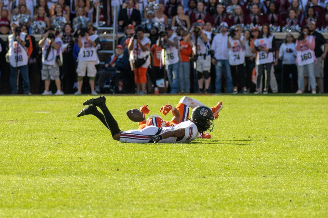 Redshirt junior defensive back Cam Smith sliding across the turf with a Clemson player after an incomplete pass on Nov. 26, 2022 at Memorial Stadium. Smith made one tackle and one assisted tackle against Clemson.