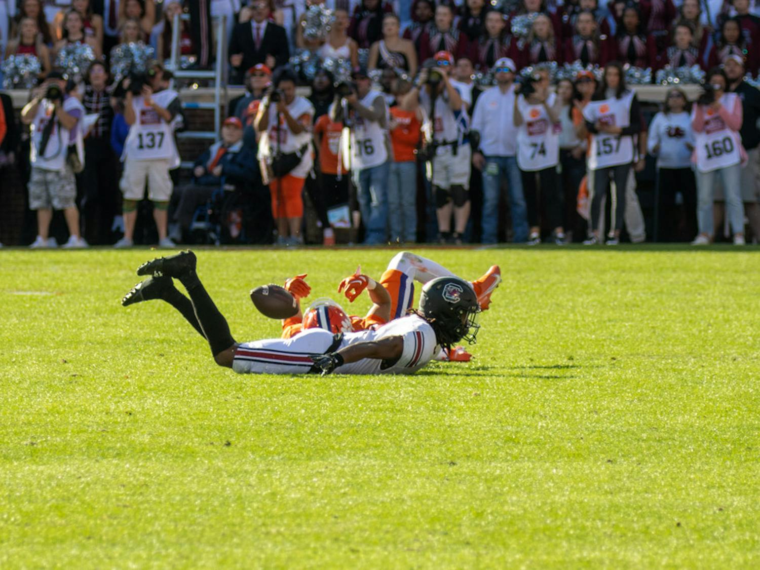 Redshirt junior defensive back Cam Smith sliding across the turf with a Clemson player after an incomplete pass on Nov. 26, 2022 at Memorial Stadium. Smith made one tackle and one assisted tackle against Clemson.