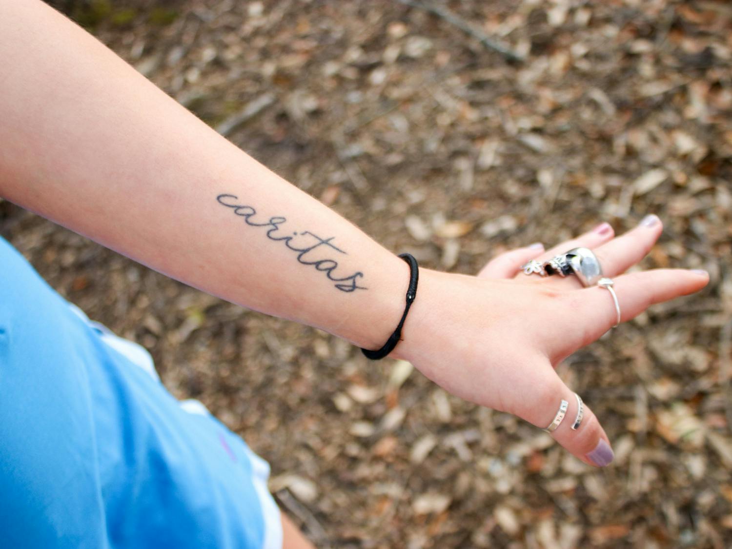 Sandford said she hopes to be a teacher after graduation. This career path was inspired by her high school Latin teacher, who she paid tribute to in the “caritas” tattoo inked on her forearm. The word — loosely translated to “universal love of humankind” — embodies a mindset that Sandford strives to carry with her each day.